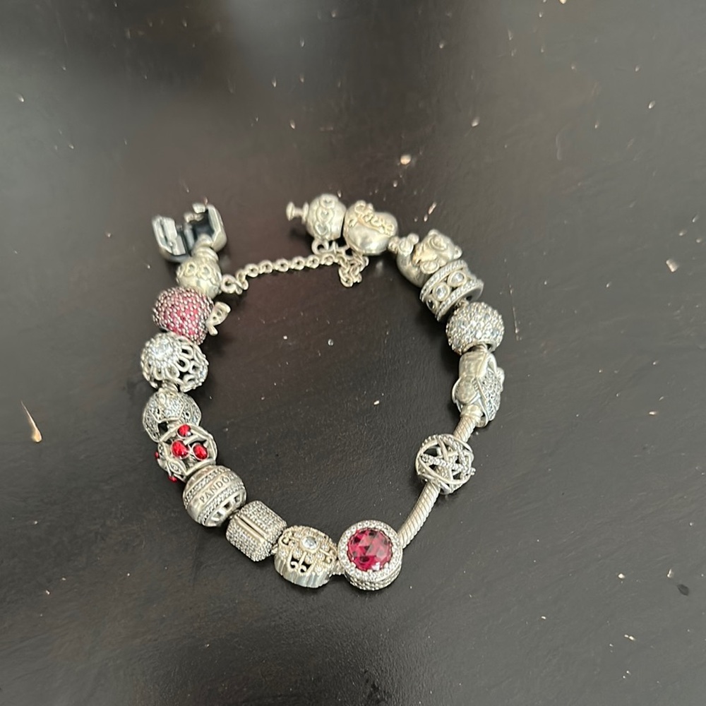 Pandora Silver and Red Charm Bracelet with Intricate Details